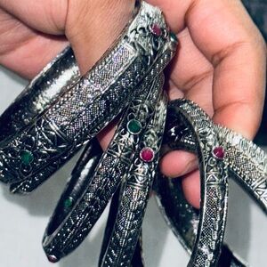 Intricate Silver Bangles with Gem Accents